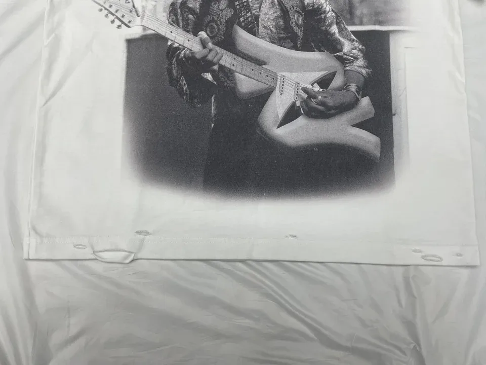 Photographed graphic T-shirt sample; its specific printing method is not identified