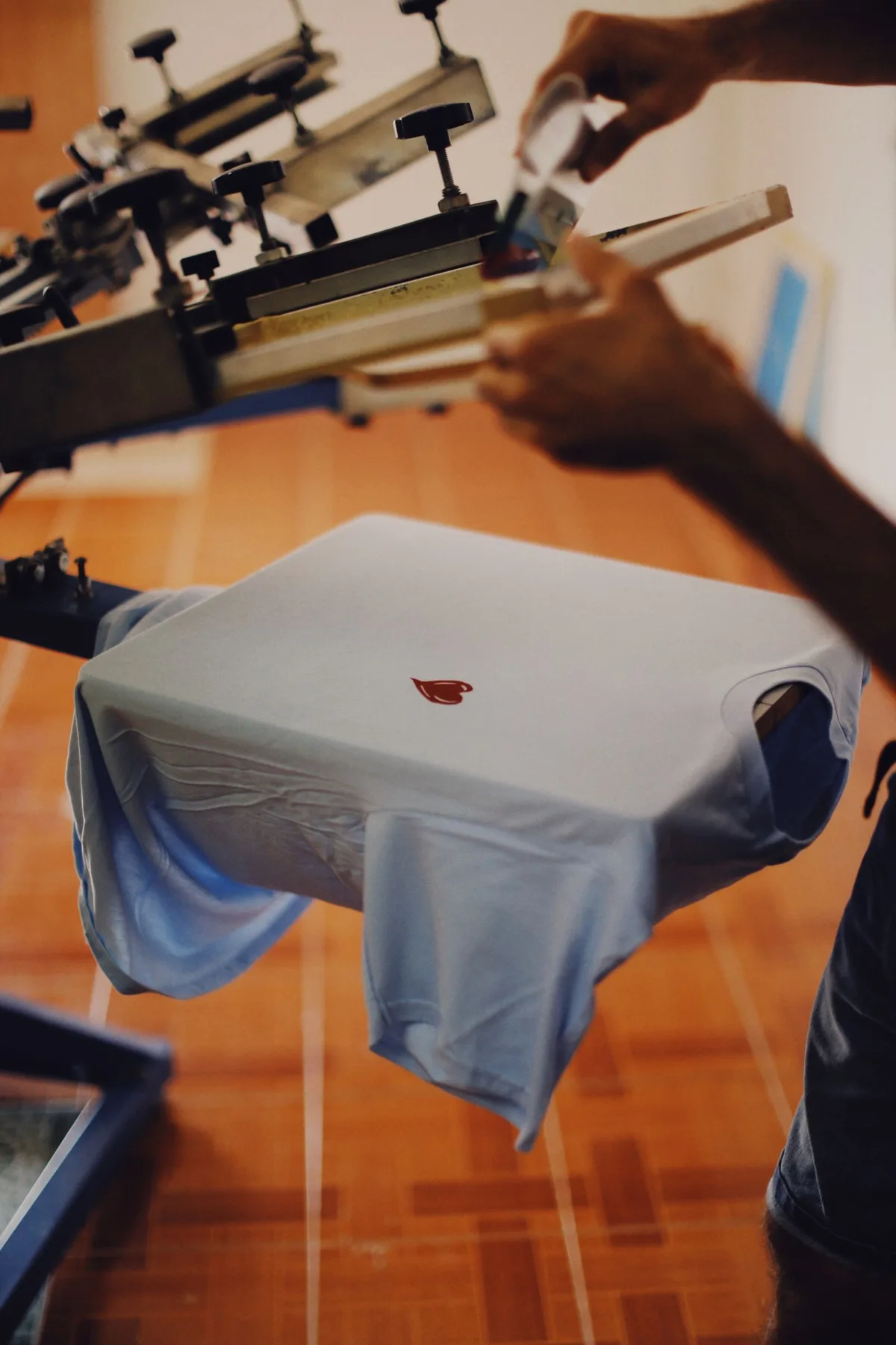 Representative photograph of a screen-printing carousel with garments