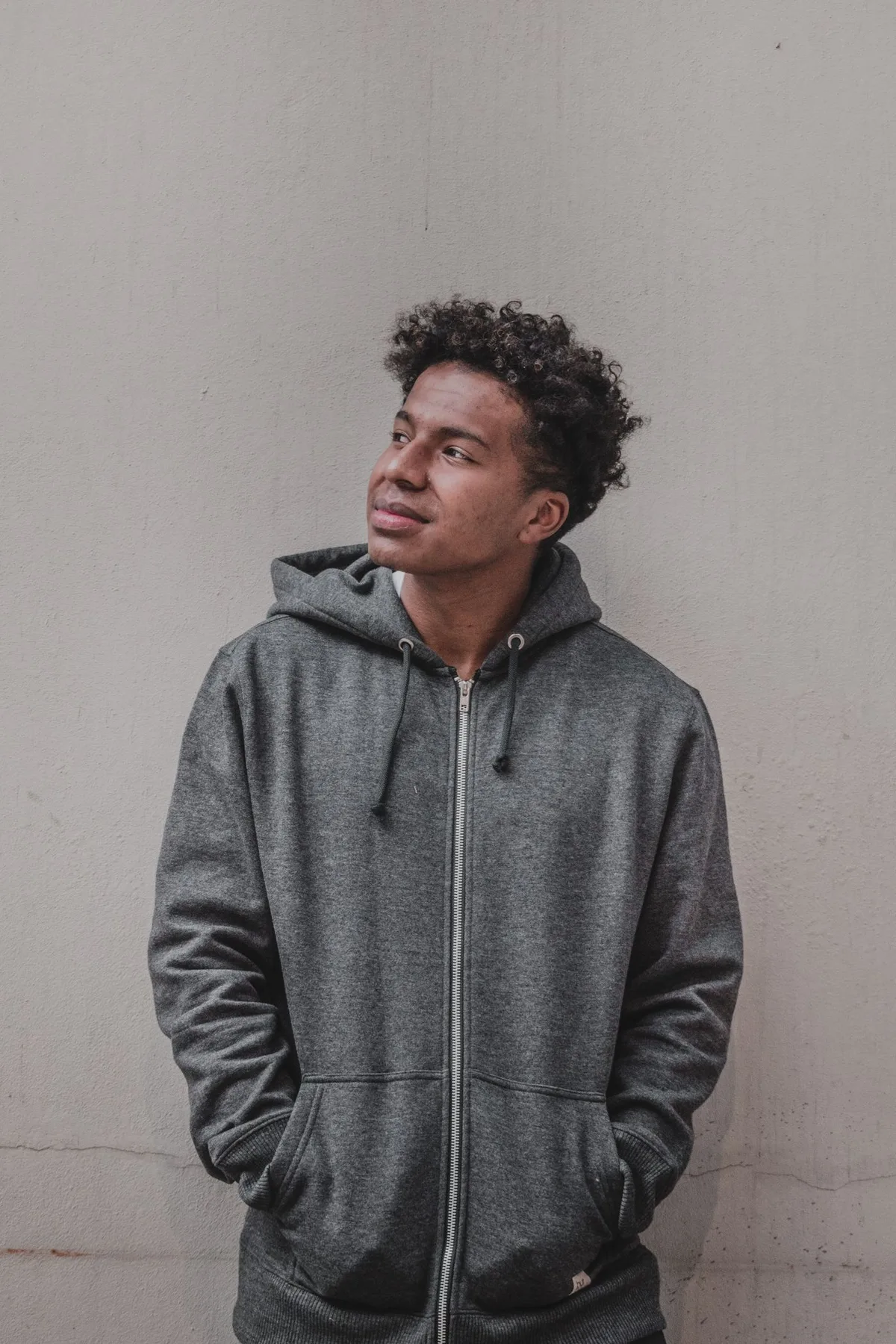 Representative styling image — On-body drape — full-zip, charcoal